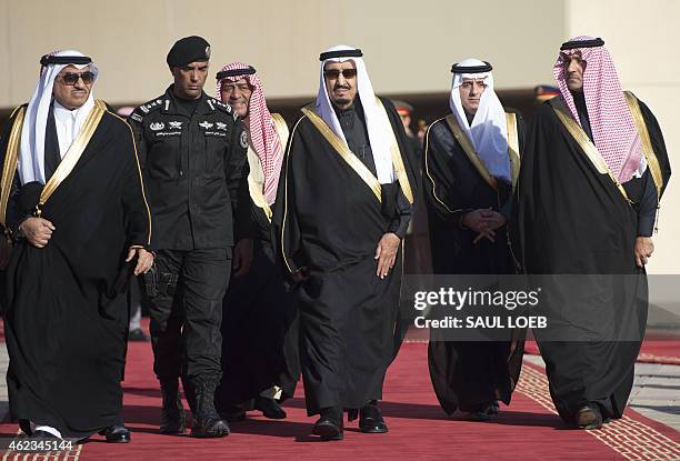 Saudi new King Salman , Crown Prince Moqren bin Abdul Aziz and deputy Crown Prince and Interior Minister Mohammed bin Nayef walk to greet US...