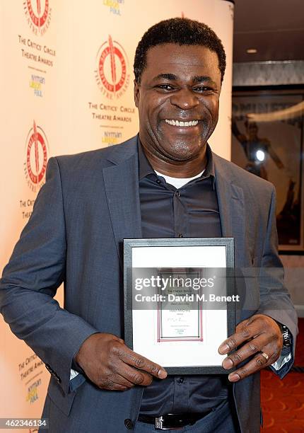 Danny Sapani accept the Best Actress Award on behalf of Helen McCrory for her part in 'Medea' at the 2015 Critics' Circle Theatre Awards at The...