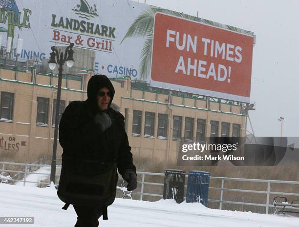 Man walks in the cold weather along the snow covered Atlantic City boardwalk on January 27, 2015 in Atlantic City, New Jersey. Much of the Northeast...