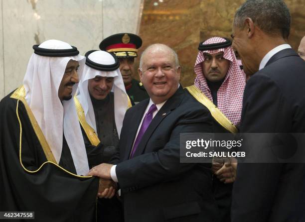 Saudi's newly appointed King Salman shakes hands with US Ambassador to Saudi Arabia Joseph Westphal during meetings with US President Barack Obama at...