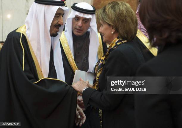 Saudi's newly appointed King Salman shakes hands with US House Minority Leader Nancy Pelosi at Erga Palace in Riyadh on January 27, 2015. Obama...