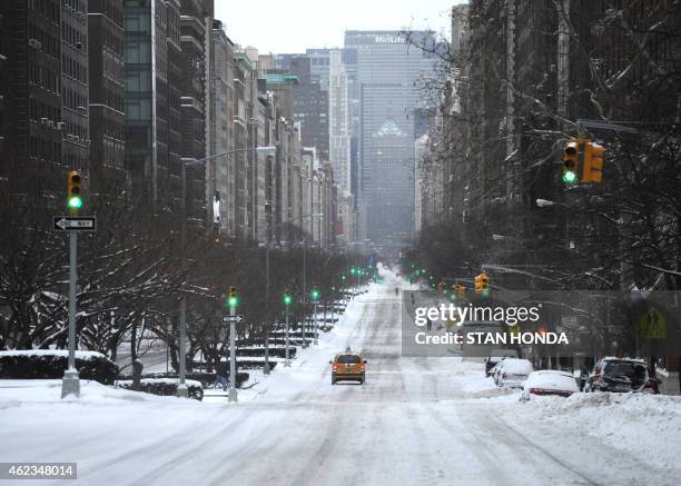 View down a nearly deserted Park Avenue during what is normally a crowed morning rush hour after a snowstorm hit New York January 27, 2015. Travel...