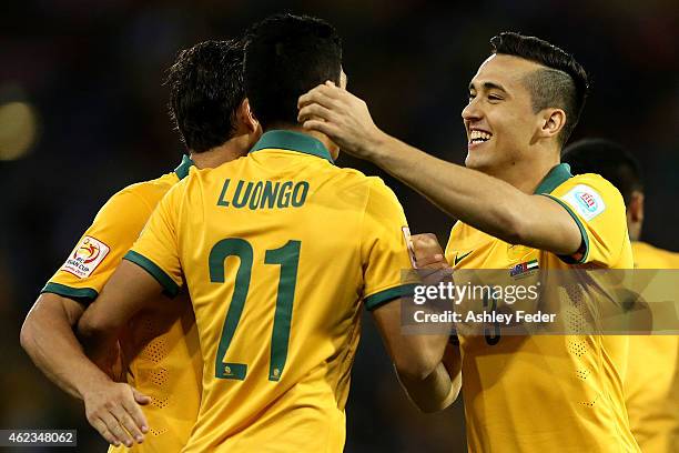 Jason Davidson of the Socceroos celebrates his goal with team mates Massimo Luongo and Mark Milligan during the Asian Cup Semi Final match between...