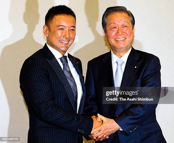 Co-Leaders Taro Yamamoto and Ichiro Ozawa shake hands during 'The People's Life Party & Taro Yamamoto And Friends' press conference on January 27,...