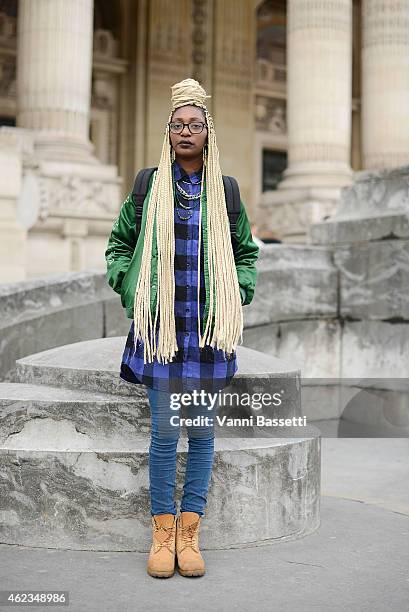 Leslie Okombi poses wearing a vintage outfit during day 3 of Paris Haute Couture Spring Summer 2015 on January 27, 2015 in Paris, France.