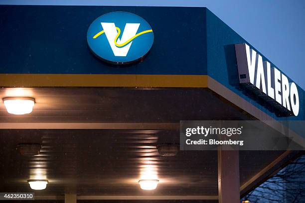 Valero Energy Corp. Sign hangs at a gas station in Washington, D.C., U.S., on Monday, Jan. 26, 2015. Valero Energy Corp. Is expected to report...