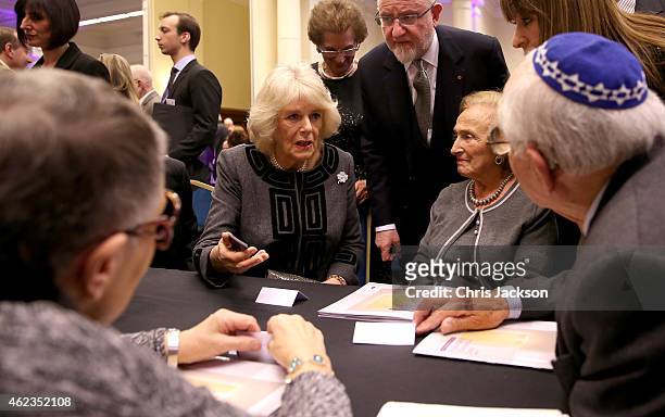 Camilla, Duchess of Cornwall meets Holocaust survivors as she attends a Holocaust Memorial Day Ceremony at Central Hall Westminster on January 27,...