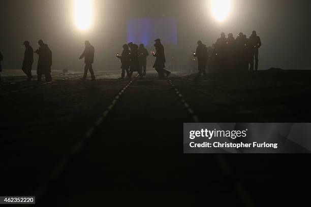 Survivors and families make their way to lay candles at the Birkenau Memorial during the commemoration of the 70th anniversary of the liberation of...