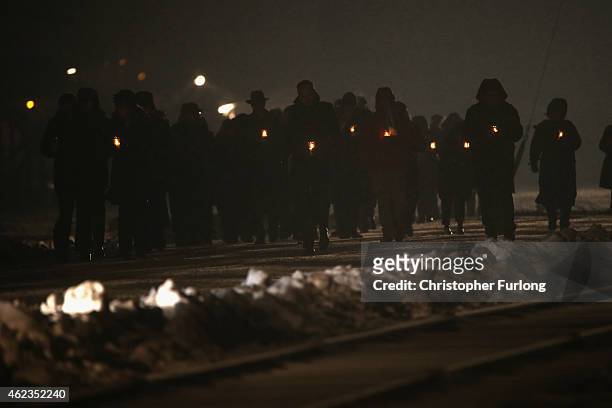 Survivors and families make their way to lay candles at the Birkenau Memorial during the commemoration of the 70th anniversary of the liberation of...