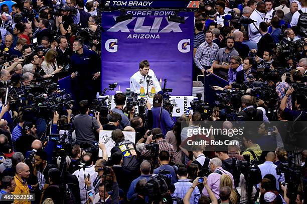 Tom Brady of the New England Patriots addresses the media at Super Bowl XLIX Media Day Fueled by Gatorade inside U.S. Airways Center on January 27,...