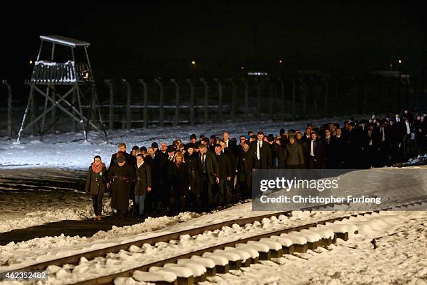 Delegations and survivors make their way to lay candles at the Birkenau Memorial during the commemoration of the 70th anniversary of the liberation...