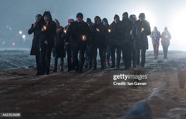 Auschwitz survivors and families visit the Birkenau Memorial carrying candles on January 27, 2015 in Oswiecim, Poland. International heads of state,...