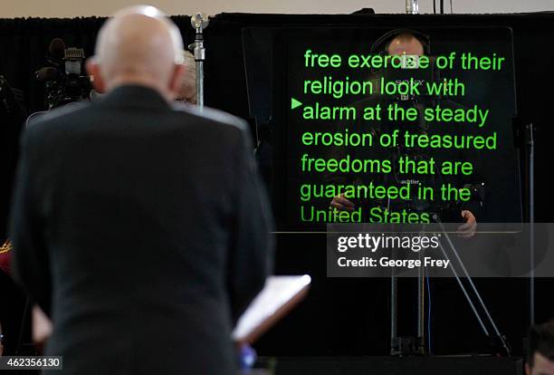 Mormon Apostle Dallin Oaks reads from a tele prompter as he announce at a news conference The Church of Jesus Christ Of Latter-Day Saints stance on...