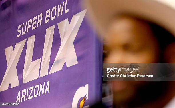 Michael Bennett of the Seattle Seahawks addresses the media at Super Bowl XLIX Media Day Fueled by Gatorade inside U.S. Airways Center on January 27,...