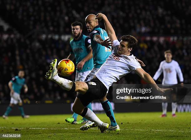 Chris Martin of Derby County battles with Alex Baptiste of Blackburn Rovers during the Sky Bet Championship match between Derby County and Blackburn...