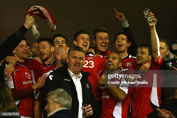 Dean Smith the manager of Walsall flanked by James Chambers celebrate reaching the final after their 2-0 victory during the Johnstone's Paint...