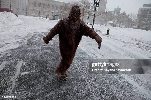 Pedestrian dressed as "bigfoot" makes their way through the strong wind and snow in the Back Bay neighborhood during a blizzard on January 27, 2015...