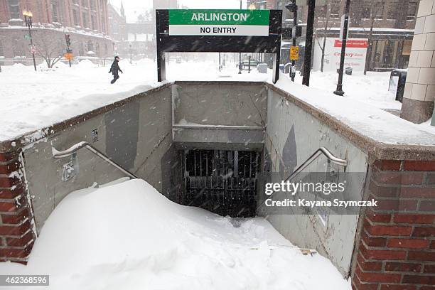 Snow piles up at the entrance of a closed T station is seen during the blizzard on January 27, 2015 in Boston, Massachusetts. All public...