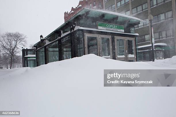 Snow piles up at the entrance of a closed T station is seen during the blizzard on January 27, 2015 in Boston, Massachusetts. All public...