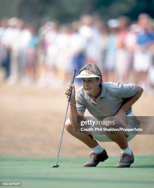 Lisa Hackney of Great Britain lines up a putt during the Women's British Open Golf Championship held at the Woburn Golf and Country Club in Milton...