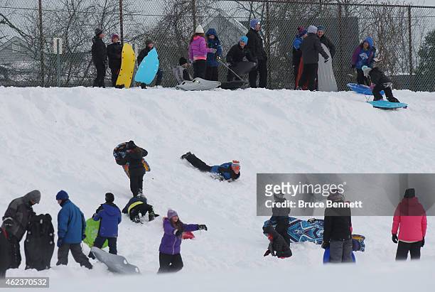 Residents take advantage of sledding opportunties at Mattlin Middle School on January 27, 2015 in Plainview, New York. The Long Island region...