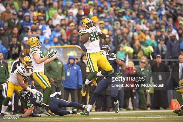 Playoffs: Green Bay Packers Brandon Bostick in action, losing control of ball during onside kick attempt vs Seattle Seahawks at CenturyLink Field....
