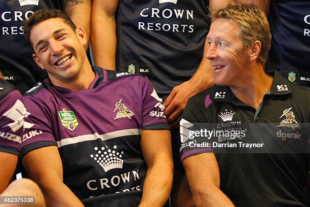 Billy Slater and coach Craig Bellamy share a laugh during the team photo shoot at a Melbourne Storm NRL media opportunity at AAMI Park on January 28,...