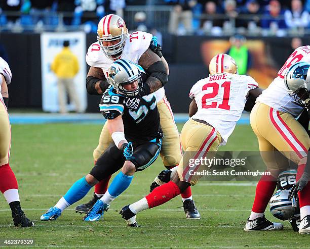 Luke Kuechly of the Carolina Panthers is blocked during the NFC Divisional Playoff Game by Mike Iupati of the San Francisco 49ers at Bank of America...