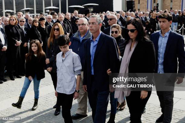 Gilad and Omri Sharon, the sons of former prime minister Ariel Sharon, follow his coffin with their families during a state memorial service at the...