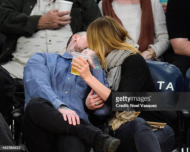 Benji Madden and Cameron Diaz kiss at a basketball game between the Washington Wizards and the Los Angeles Lakers at Staples Center on January 27,...