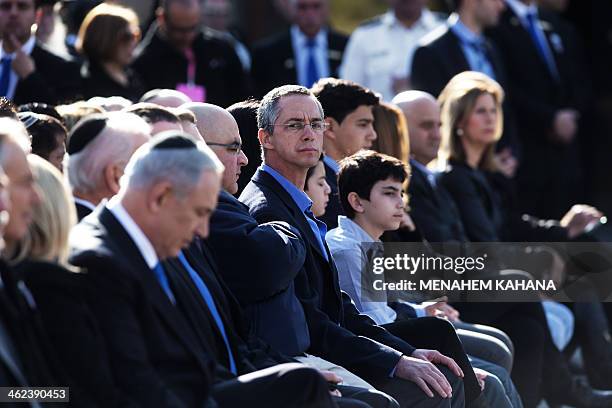 Israel's Prime Minister Benjamin Netanyahu sits next to Ariel Sharon's sons Omri and Gilad and their families during the late premier's state...