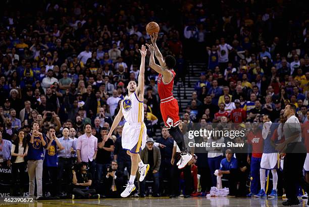 Derrick Rose of the Chicago Bulls shoots the game-winning basket over Klay Thompson of the Golden State Warriors in overtime at ORACLE Arena on...