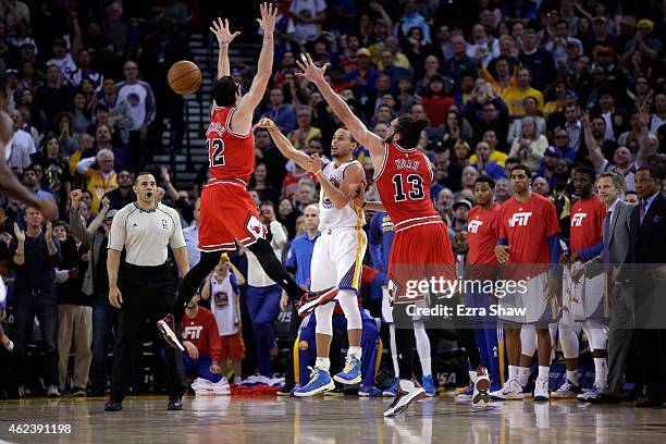 Kirk Hinrich and Joakim Noah of the Chicago Bulls force Stephen Curry of the Golden State Warriors to turn the ball over with 18 seconds left in the...