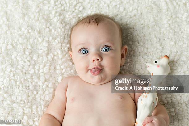 baby making a funny face - funny face baby stock pictures, royalty-free photos & images