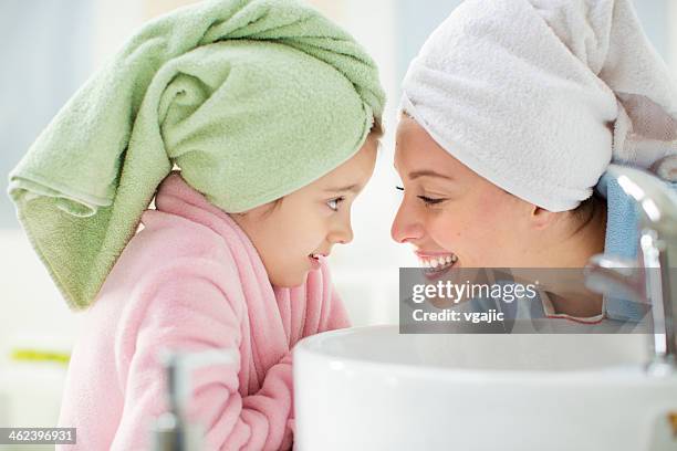mother and daughter in bathroom. - kid girl towel stock pictures, royalty-free photos & images