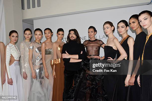 Stephane Rolland poses with his models at the finale of the Stephane Rolland Show as part of Paris Fashion Week Haute Couture Spring/Summer 2015 on...