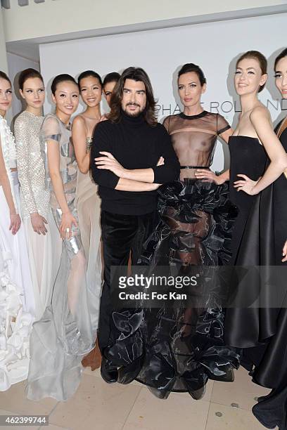 Stephane Rolland poses with his models at the finale of the Stephane Rolland Show as part of Paris Fashion Week Haute Couture Spring/Summer 2015 on...
