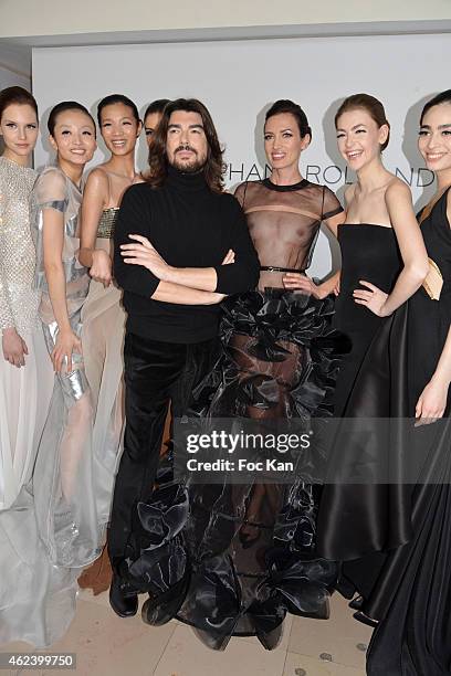 Stephane Rolland poses with his models at the finale of the Stephane Rolland Show as part of Paris Fashion Week Haute Couture Spring/Summer 2015 on...