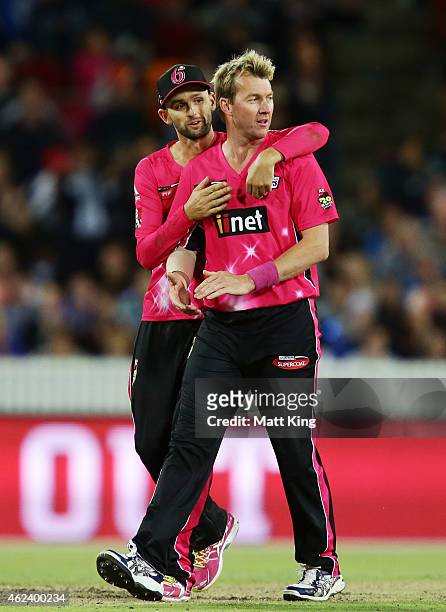 Brett Lee of the Sixers celebrates with Nathan Lyon after taking the wicket of Michael Klinger of the Scorchers during the Big Bash League final...