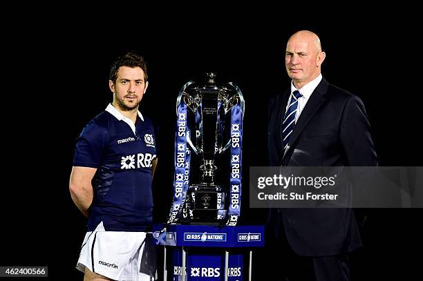 Greig Laidlaw of Scotland and Vern Cotter the coach of Scotland pose with the trophy during the launch of the 2015 RBS Six Nations at the Hurlingham...