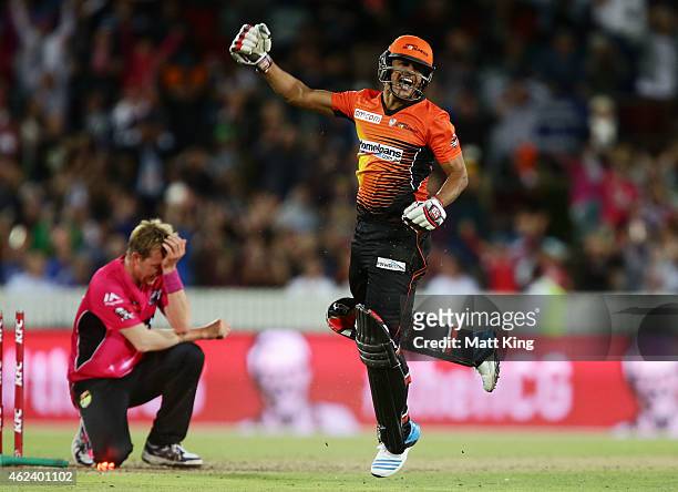 Yasir Arafat of the Scorchers celebrates victory as Brett Lee of the Sixers looks dejected during the Big Bash League final match between the Sydney...