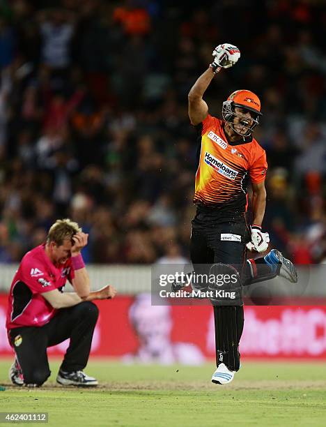 Yasir Arafat of the Scorchers celebrates victory as Brett Lee of the Sixers looks dejected during the Big Bash League final match between the Sydney...