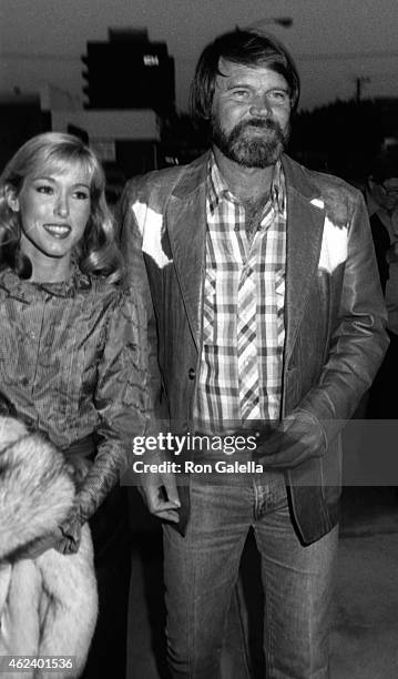 Tanya Tucker and Glen Campbell attend Pierre Cossette Super Bowl Party on January 24, 1982 at Chasen's Restaurant in Beverly Hills, California.