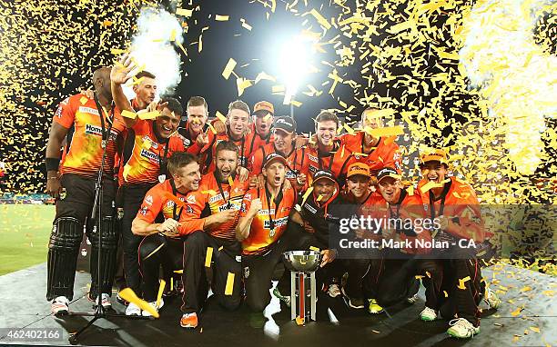 The Scorchers pose for photos and celebrate winning the Big Bash League final match between the Sydney Sixers and the Perth Scorchers at Manuka Oval...