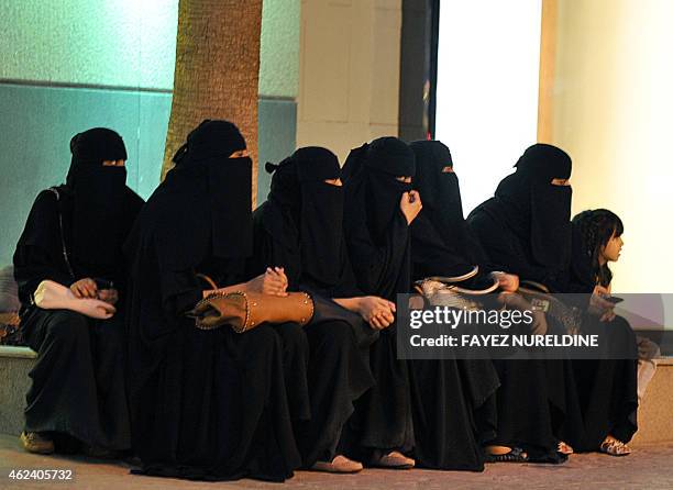 Saudi women wait for their drivers outside a shopping mall in Riyadh on September 26, 2011 a day after King Abdullah granted women the right to vote...