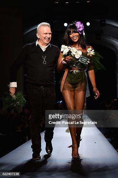 Fashion designer Jean Paul Gaultier and model Naomi Campbell walk the runway at the end of the Jean Paul Gaultier show as part of Paris Fashion Week...