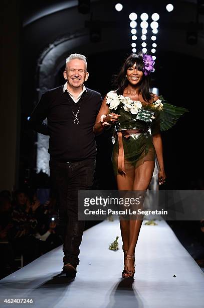 Fashion designer Jean Paul Gaultier and model Naomi Campbell walk the runway at the end of the Jean Paul Gaultier show as part of Paris Fashion Week...