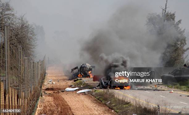 Israeli military vehicles are seen burning in the Shebaa farms an occupied area along the Israeli-Lebanese border near Ghajar village, on January 28...