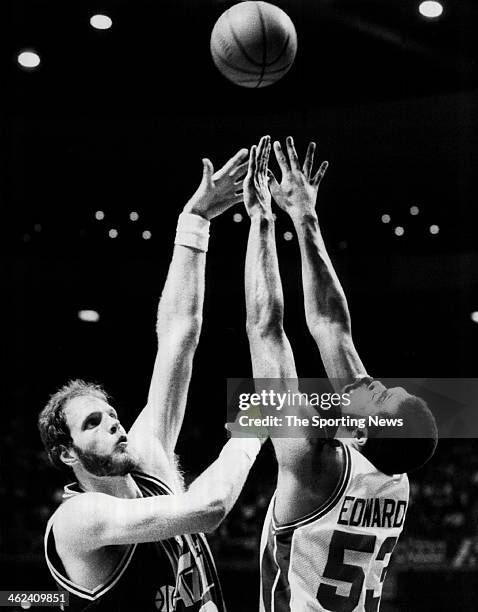 Mark Eaton of the Utah Jazz attempts a shot against James Edwards of the Detroit Pistons circa 1991.