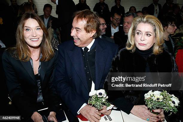 Carla Bruni-Sarkozy, Gilles Dufour and Catherine Deneuve attend the Jean Paul Gaultier show as part of Paris Fashion Week Haute Couture Spring/Summer...